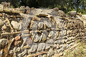 Detail of unusual ancient greek rock wall design and pattern near the Leonidaion in Olympia Greece