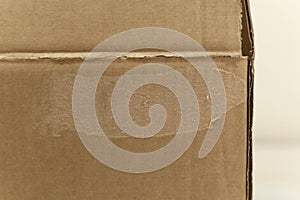 Detail of an unwritten cardboard box. photo