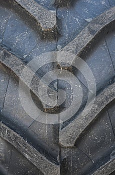 Detail up close of a tire tread from a tractor.