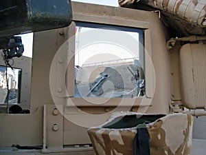 Detail of a US Humvee with a bullet mark