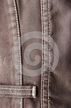 Detail from an used brown jeans