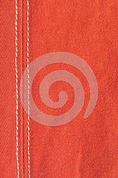 Detail from an used red jeans