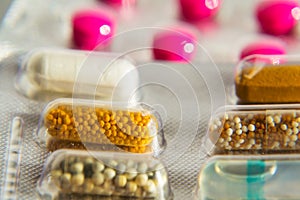 Colorful pills in transparent medicine capsule, nanotechnology future medicine concept