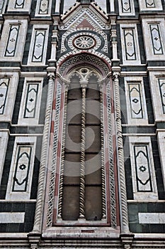 Detail, very light and elaborate, of two twin windows, of the wall of the cathedral Santa Maria del Fiore in Florence.