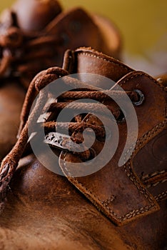 Detail of very old shoelaces on leather boots