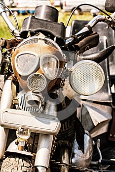 Detail of veteran motorbike with symbolic gas mask, retro photo