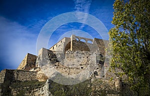 Detail view from below of the imposing Morella castle, CastellÃ³n, Spain photo