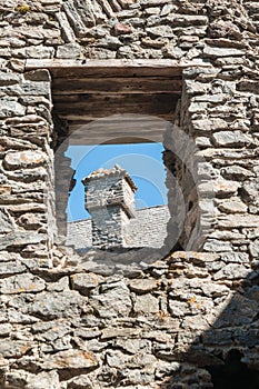 Detail view of a castle ruin, view through a window onto a small tower