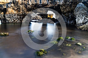 Detail view of the caves of the Cuevas del Mar beach in Asturias photo