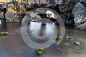 Detail view of the caves of the Cuevas del Mar beach in Asturias photo