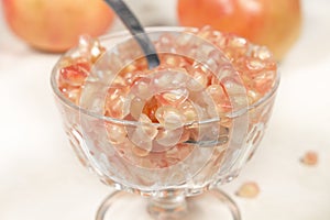 Detail view of crystal goblet full of white pomegranate grains