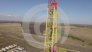 Detail view of oil well in field in nature in summer day, aerial shot