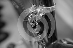 Detail view of a racing bicycle`s front derailleur