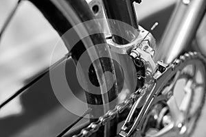 Detail view of a racing bicycle`s front derailleur