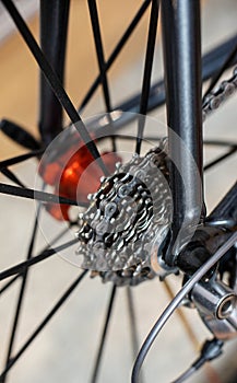 Detail view of rear bicycle axle and racing gears