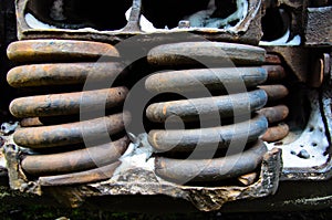 Detail view on a rusty springs of the old boxcar
