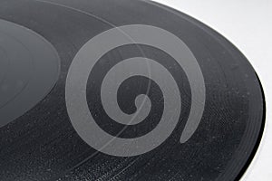 Detail view of vinyl record on white