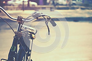 Detail of a Vintage Bicycle Handlebar Resting in the city Street