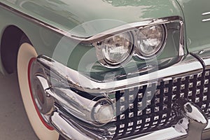 Detail of a vintage car. Close up of headlight retro classic car. Vintage effect style pictures. Classic car