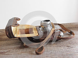 Detail of vintage film camera on wooden background