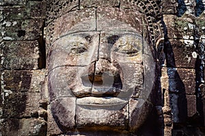 Detail of vintage stone face in the Bayan temple at Angkor Wat