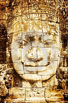 Detail of vintage stone face in the Bayon temple at Angkor Wat