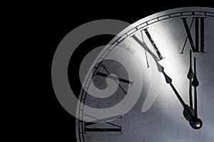Detail of a vintage wall clock showing five minutes to midnight as a symbol for time running out
