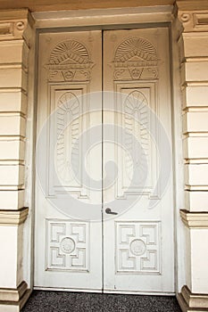 Detail of a vintage white door to an old colonial era heritage house in the town of Ipoh