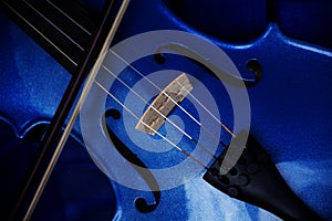 Detail of a violin with blue glitter varnish, music instrument b