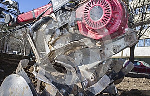 Detail Walking tractor equiped with plow at urban park