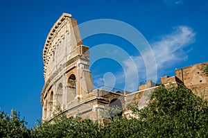 Detail of the wall of the Colosseum in a bright sunny summer day in Rome, Italy