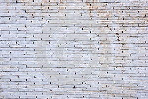 Wall made with white stained bricks photo