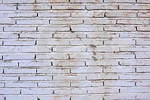 Wall made with white stained bricks photo