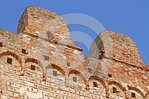 Detail of wall of red brick of a castle