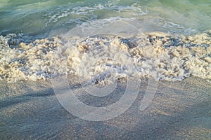 Detail of a wave in Caribbean beach in Dominican Republic