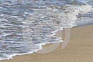 Detail of waves on the beach