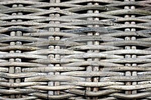 Detail of a weathered cane beach chair