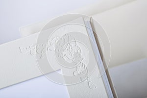 Detail of Wedding photobook and box in white leather binding.