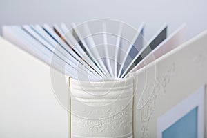 Detail of Wedding photobooks in white leather binding. Photo books with embossing and a cover of genuine leather.