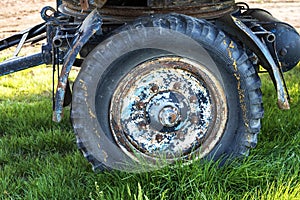 Detail of the wheel of an old caravan and drawbar