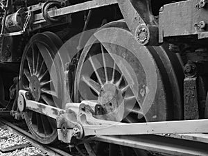 Detail of the wheels of a vintage rail road train steam engine