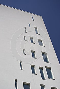 Detail of a white building with windows particular