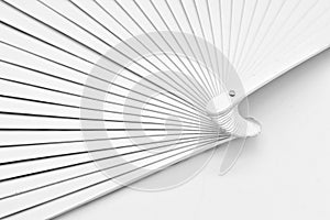 Detail of a white painted wooden fan photo