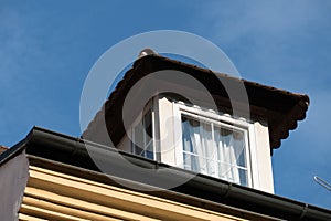 Detail of a window on a roof of an old house