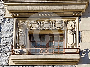 Detail of a window surrounded by shields