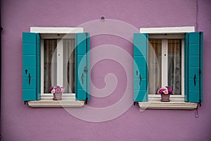 Detail of windows and colorful painted door, Burano island, Venice, Veneto, Italy, Europe.