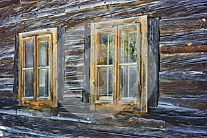Detail of windows of old traditional wooden house in Lednica village