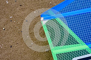 Detail of a windsurfing sail on the sand