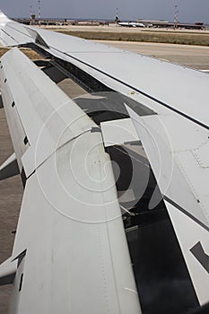 Detail of the wing of an airplane with flaps in motion