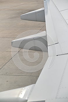 Detail of a wing of a commercial passenger airplane parked